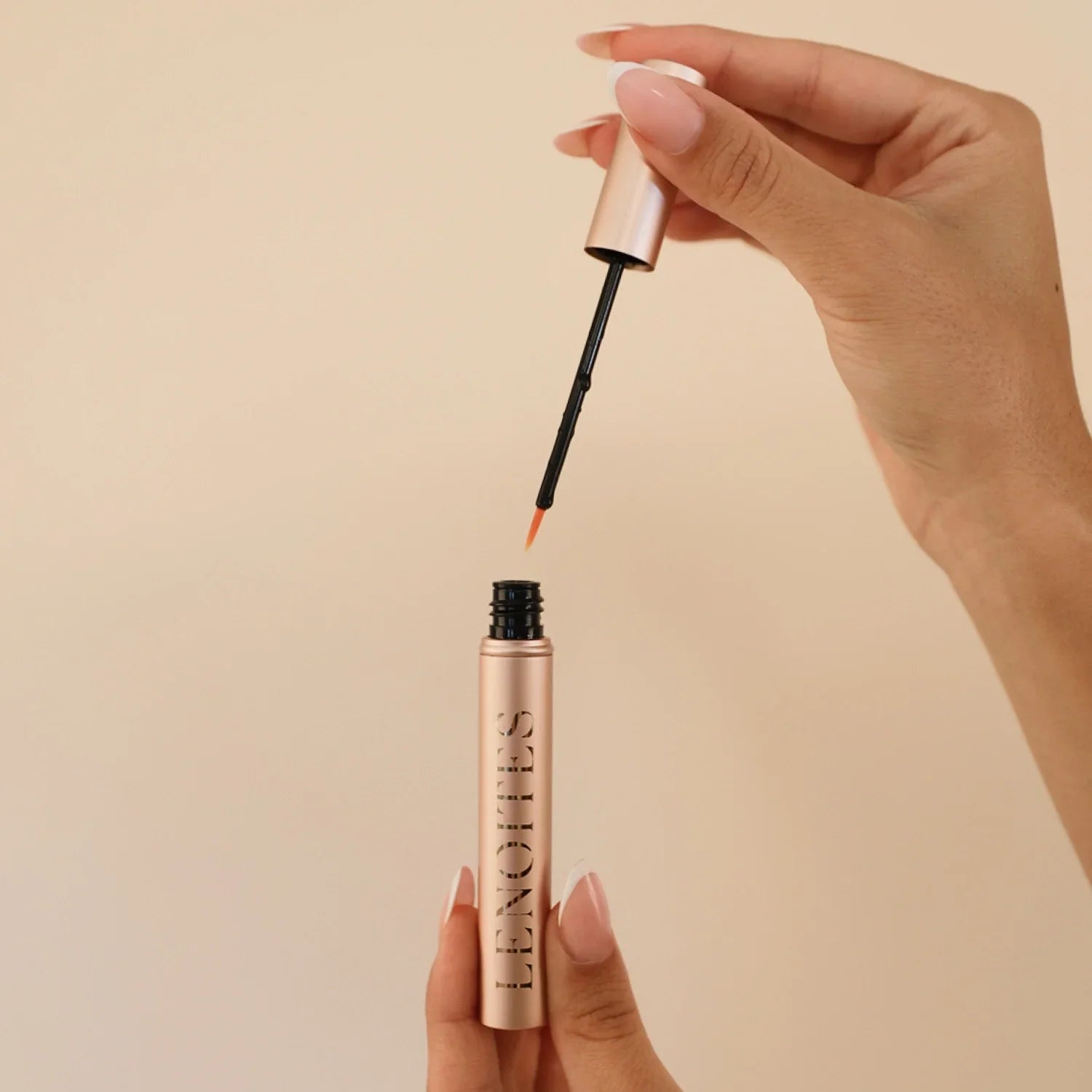 Eyelash Growth Serum on a beige background