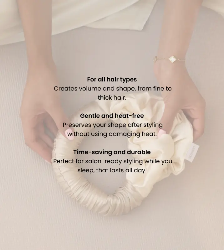 Hands holding a Lenoites Blowout Tie in Mulberry silk with product benefits listed: suitable for all hair types, gentle and heat-free, time-saving and durable.